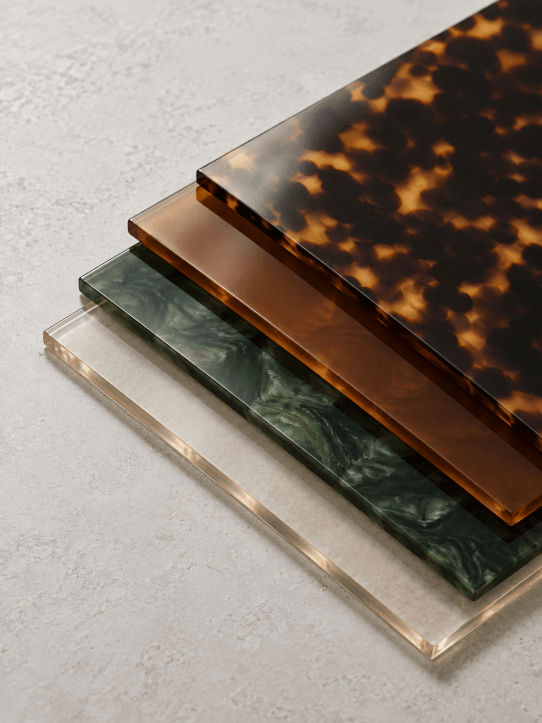 Stacked acetate sheets in tortoiseshell, green and translucent colors