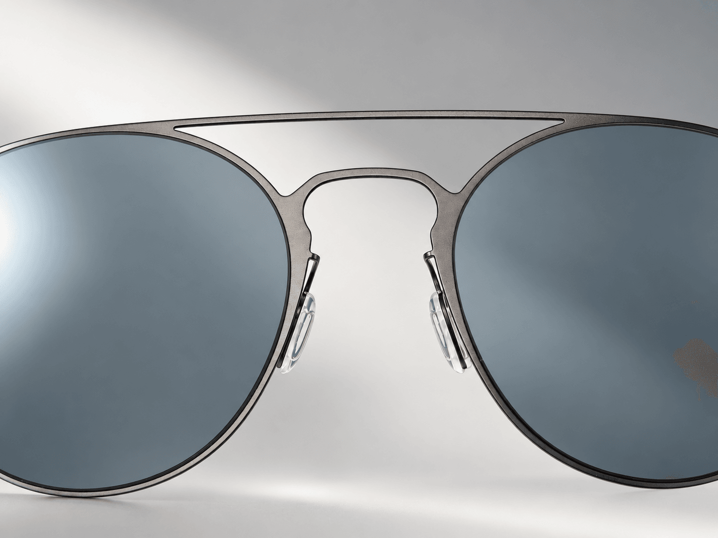 Cinder double bridge and blue-gray lens detail