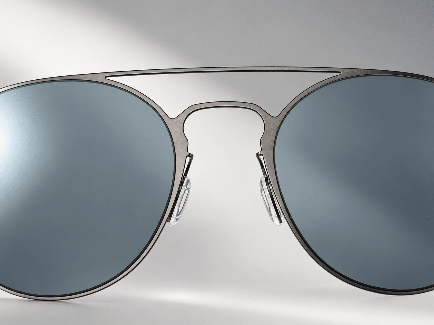 Cinder double bridge and blue-gray lens detail