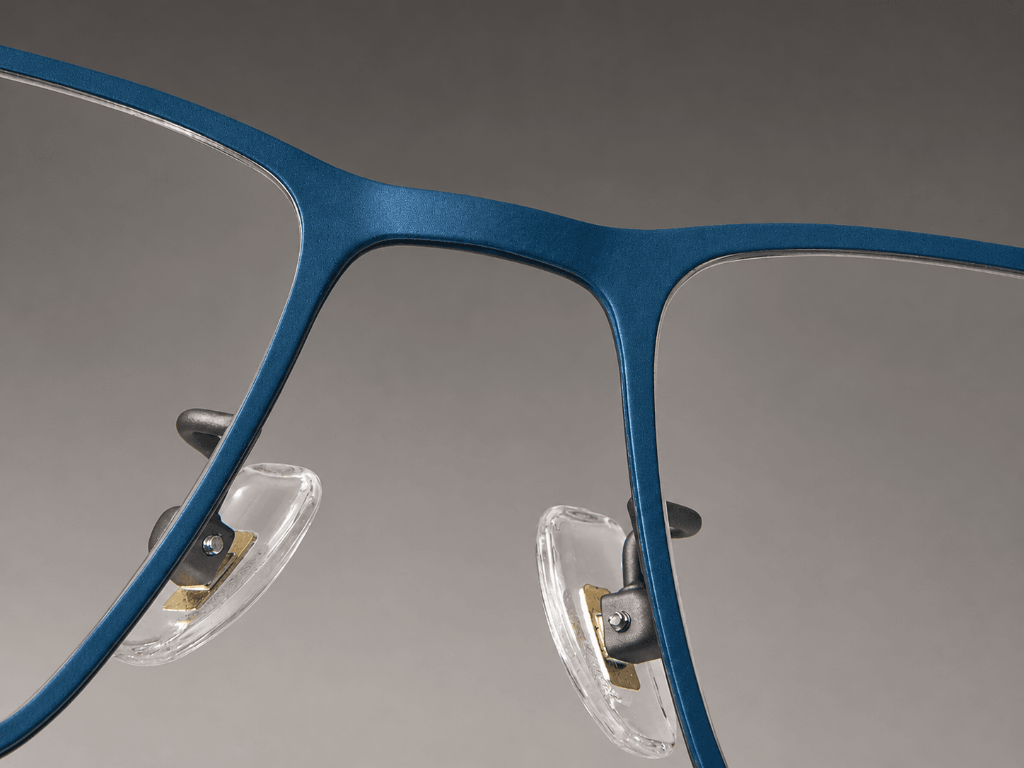 S-L7021 blue front bridge and rectangular rims with clear nose pads.