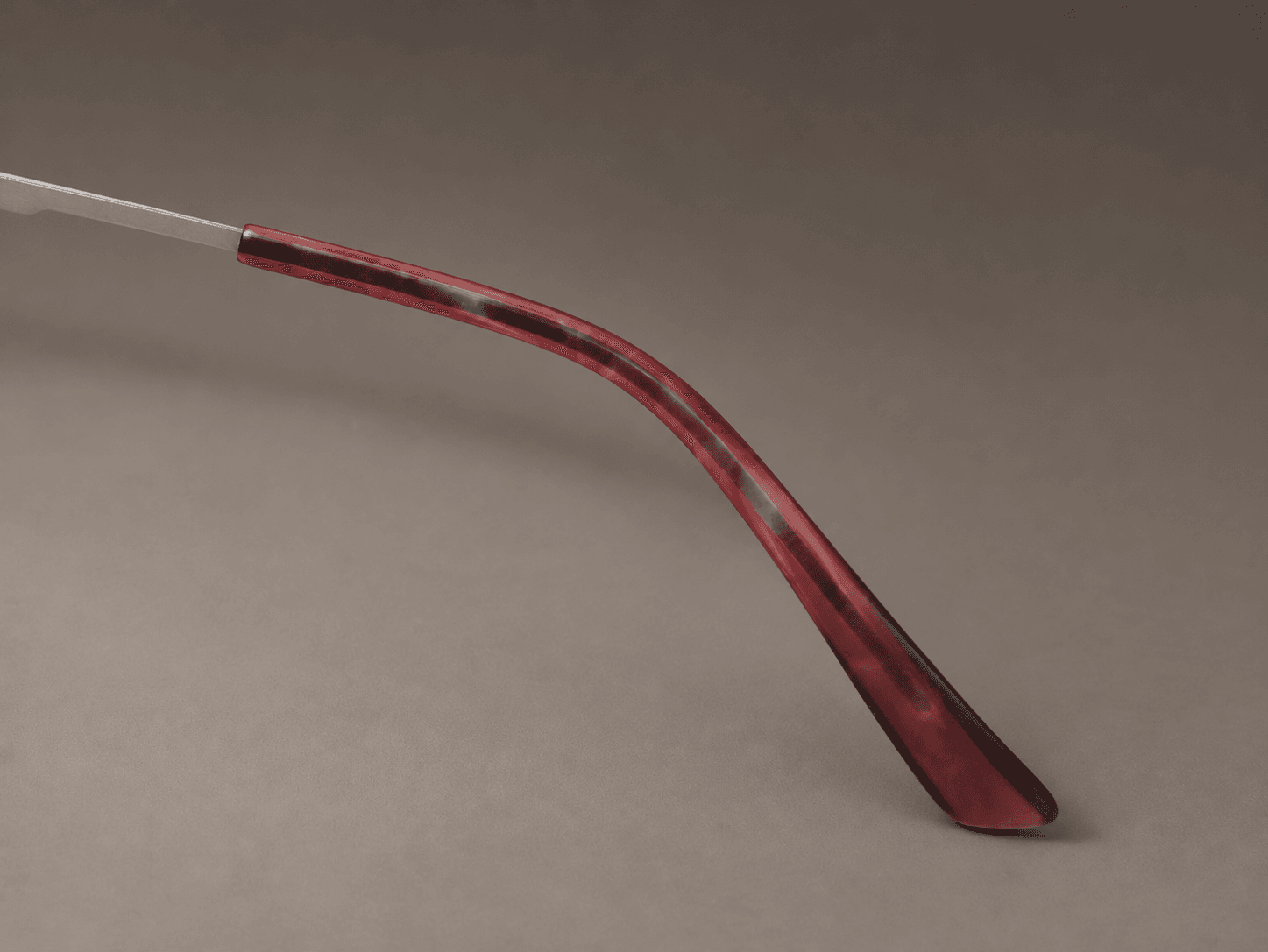 S-L7026 red-patterned curved temple tip on a slender silver-tone metal temple.