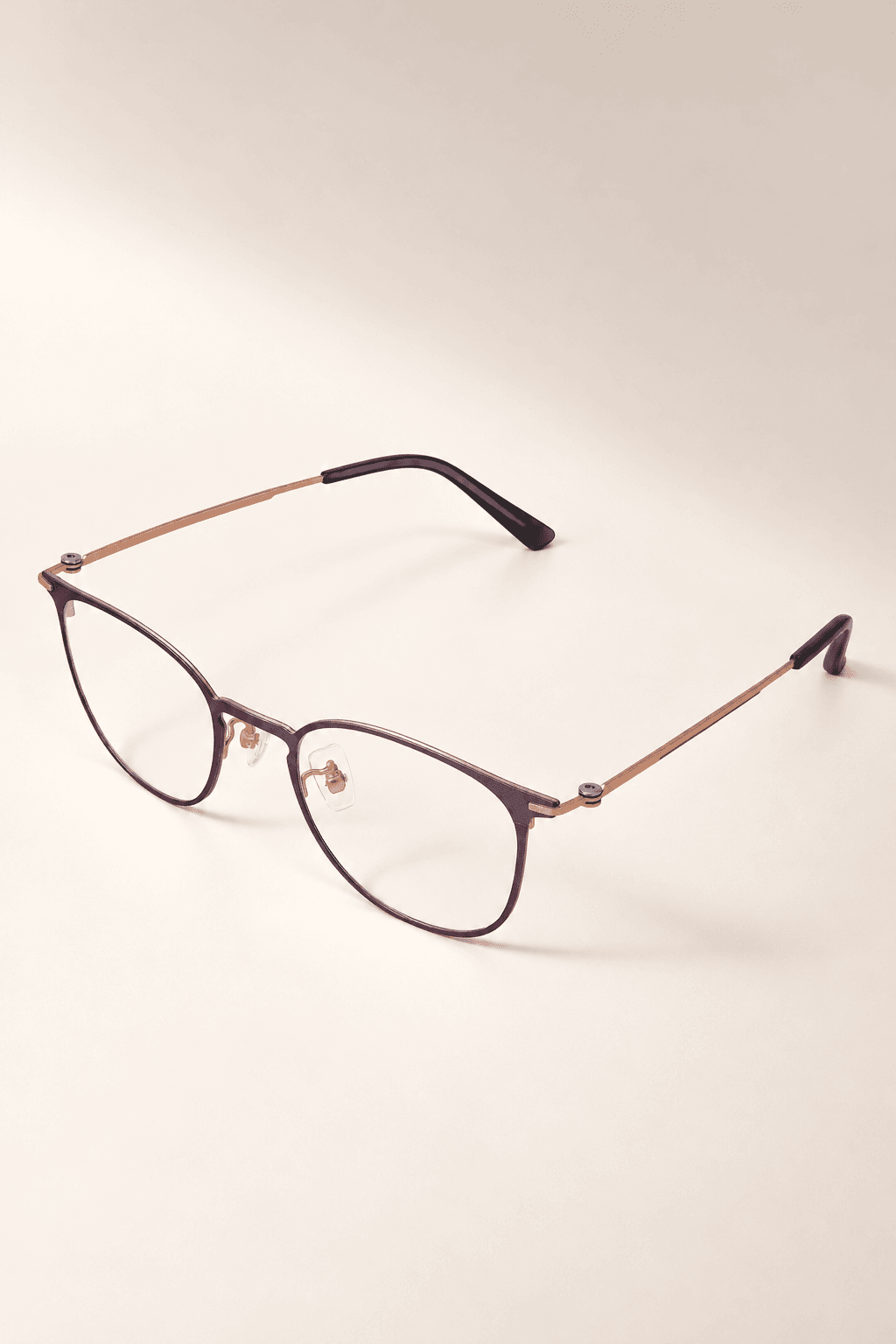 S-L7019 two-tone soft-square titanium optical frame with rose-gold-tone temples and black tips, portrait view.