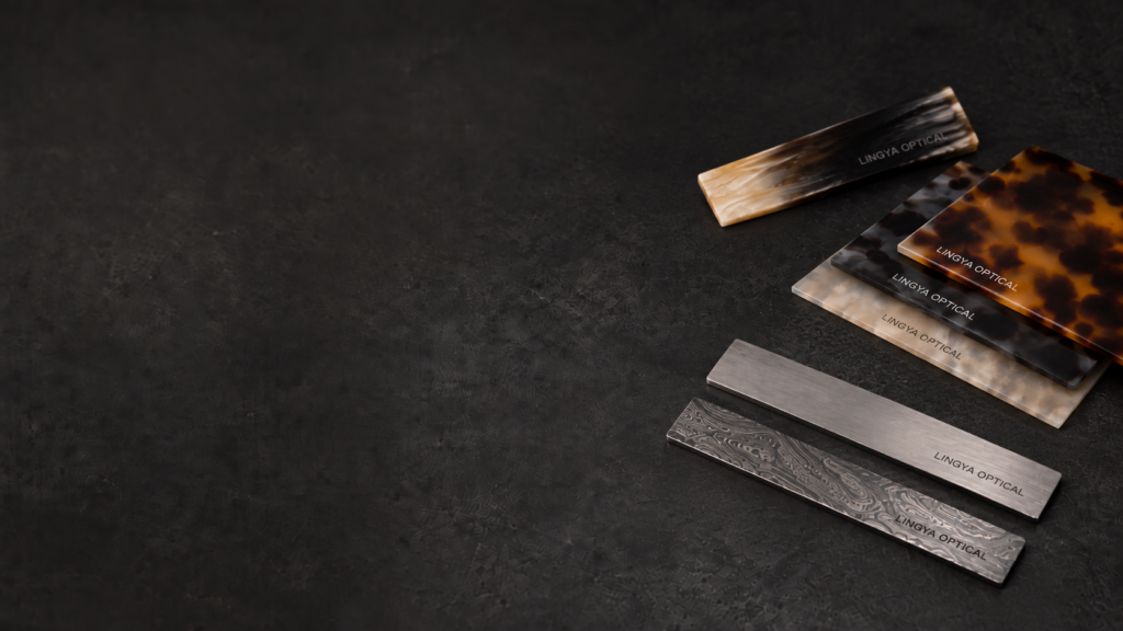 Eyewear material samples arranged on a dark workbench